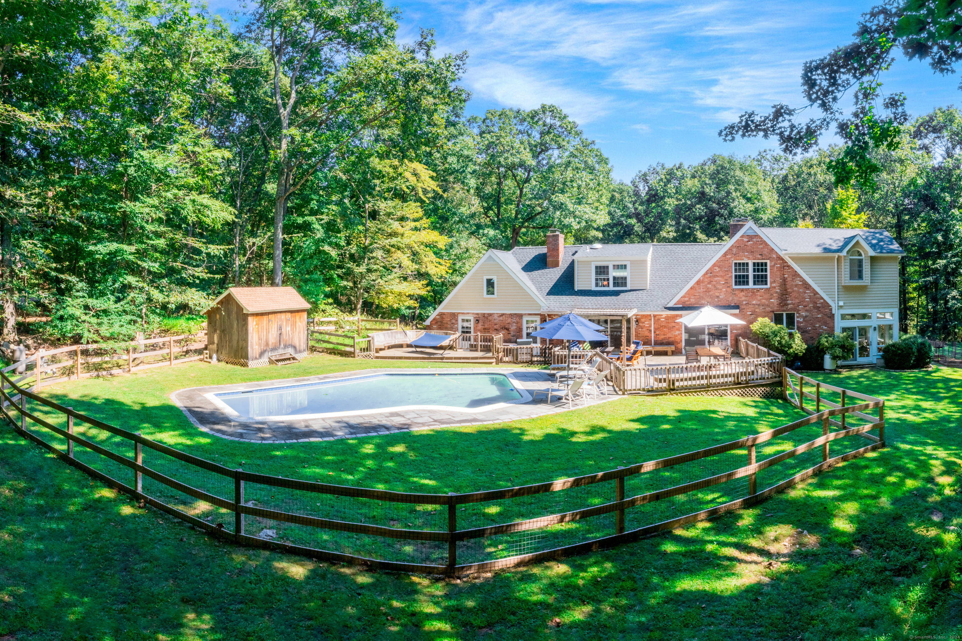 A view of the backyard with its stunning saltwater pool and deck.