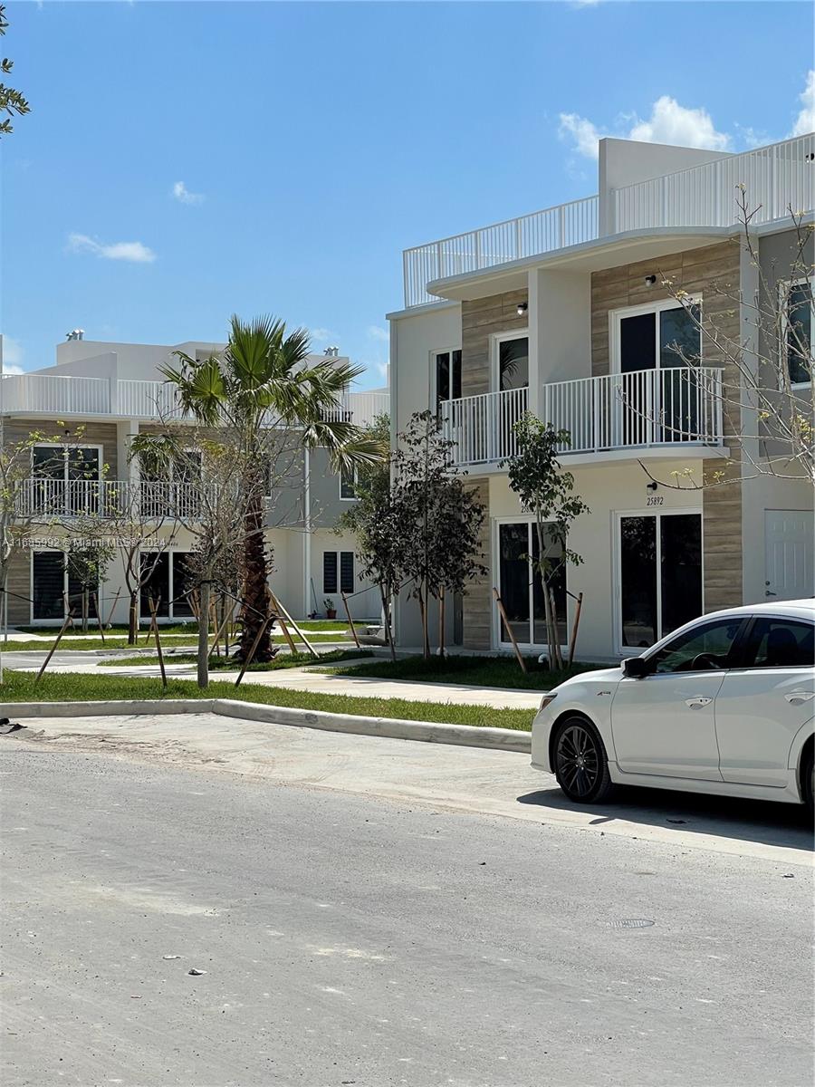 a view of a car parked in front of a building