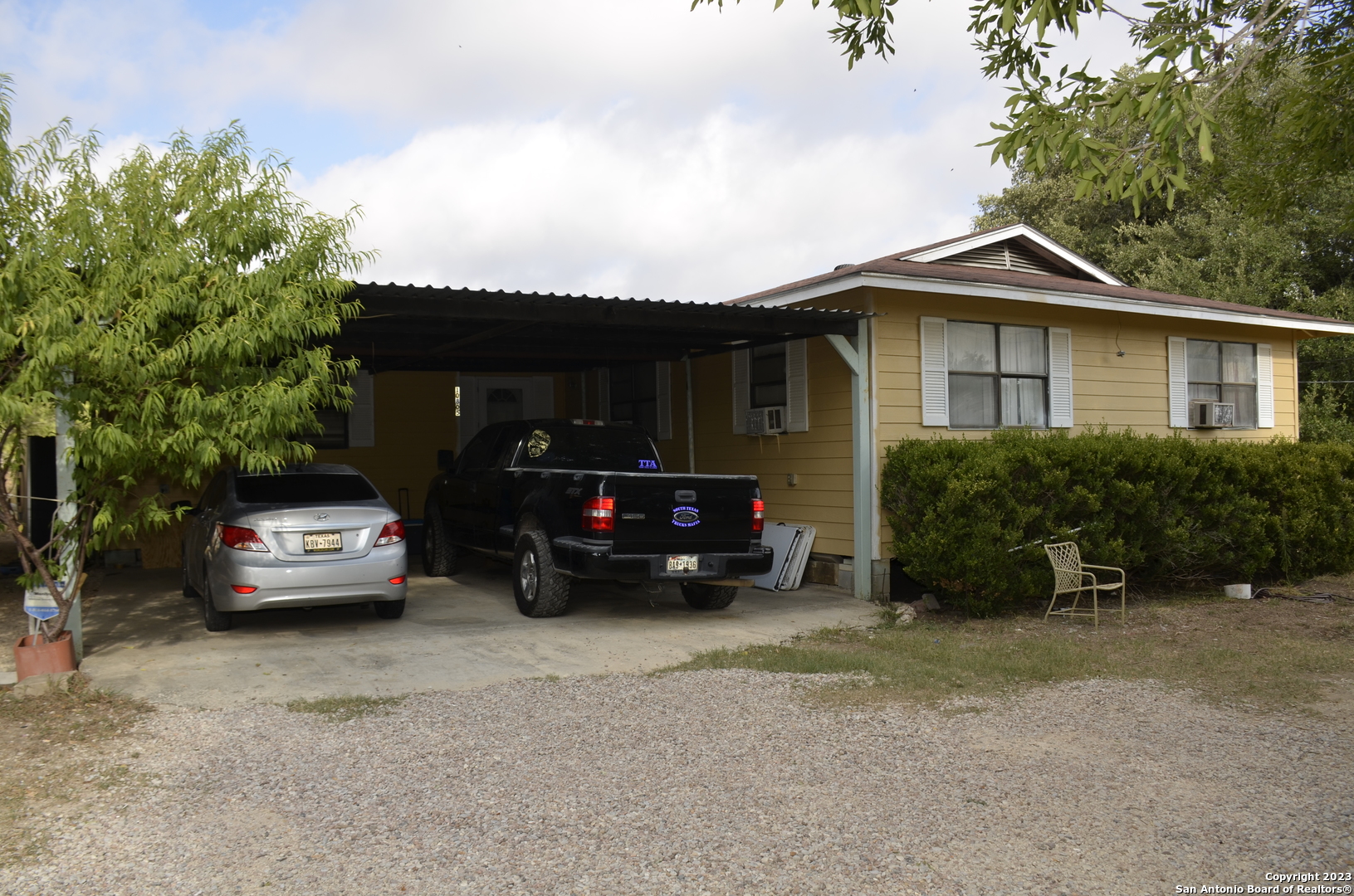 a view of a car parked in front of a house