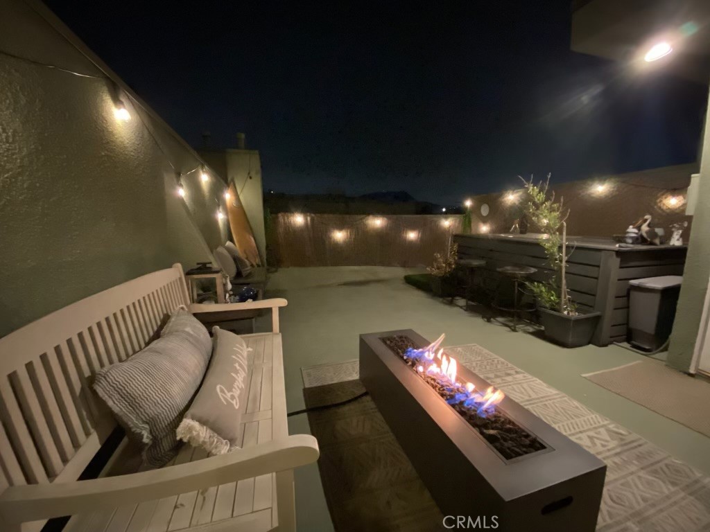 a outdoor living space with furniture and a fireplace