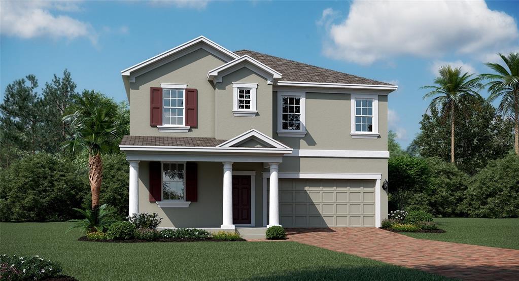 a front view of a house with a yard and trees