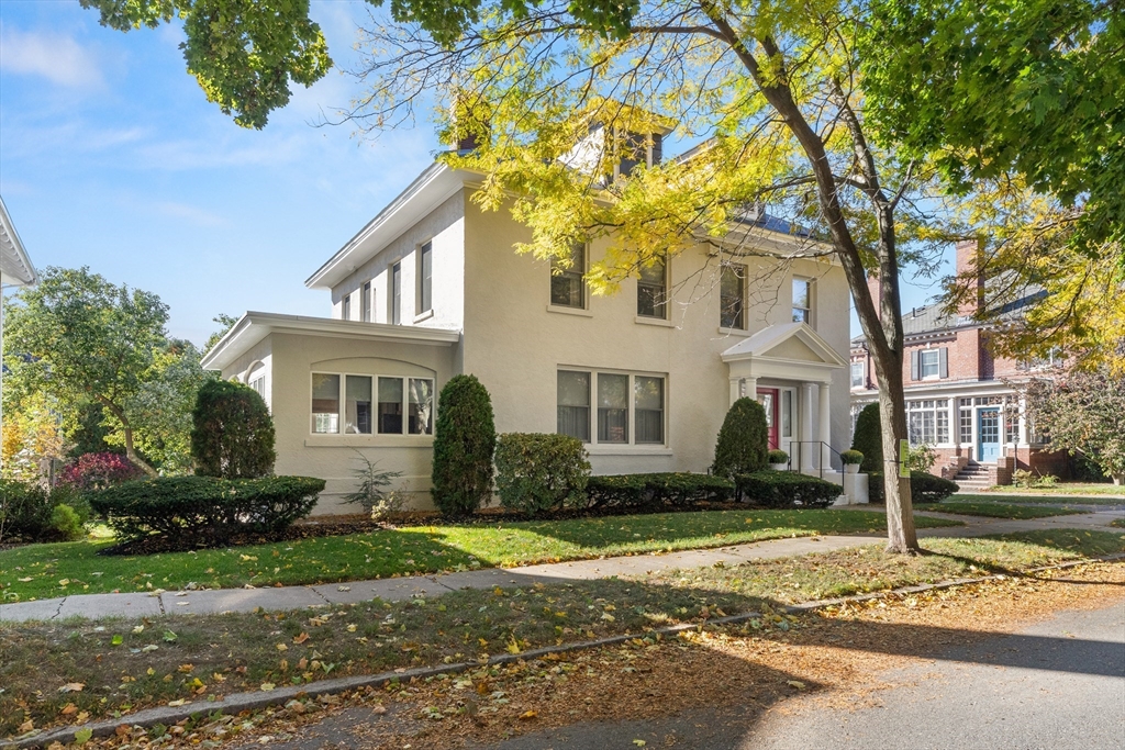 a front view of a house with a yard