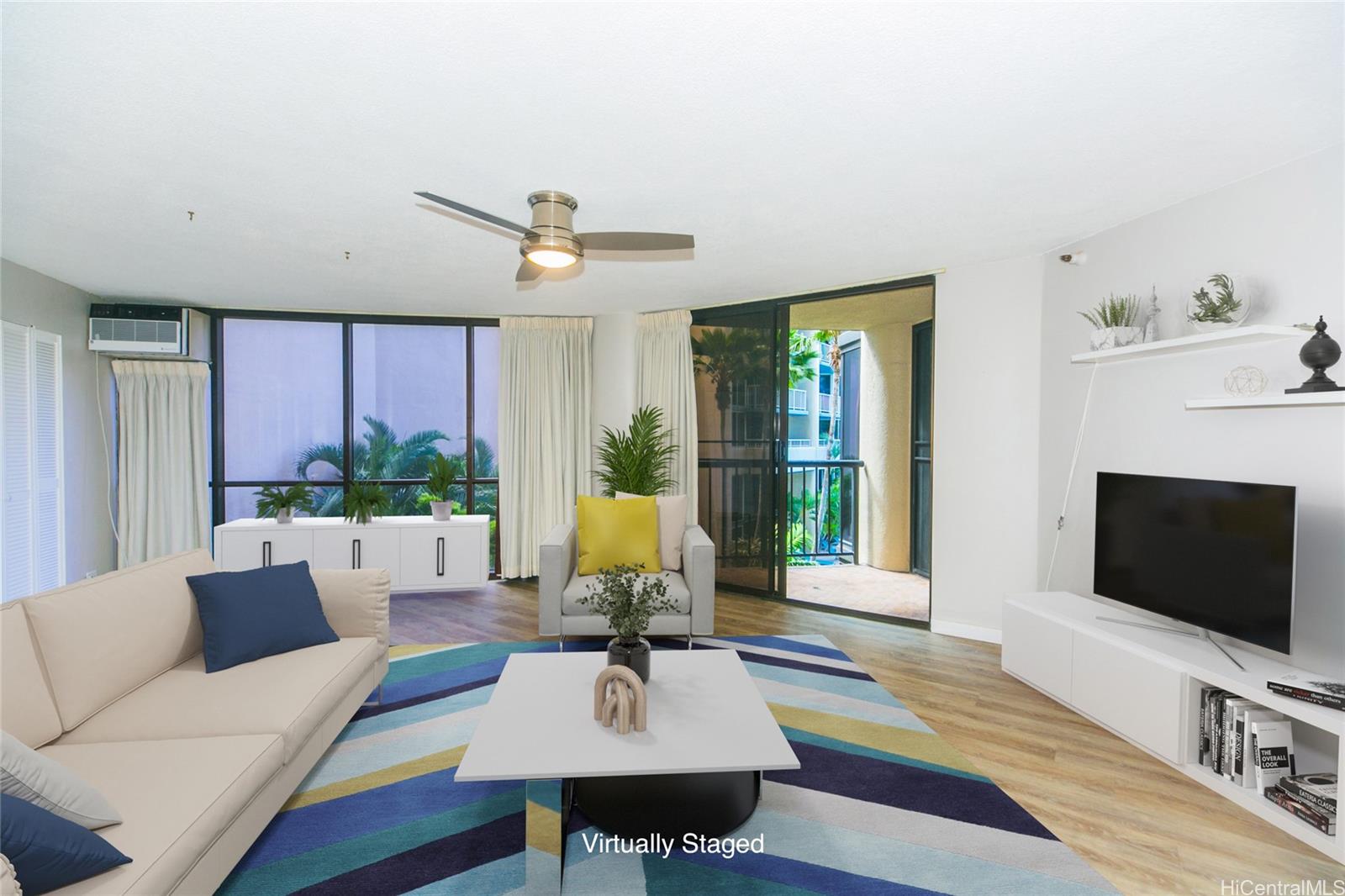 a living room with furniture a flat screen tv and a large window