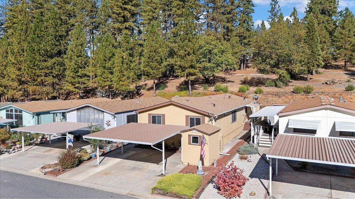 an aerial view of a house with a yard