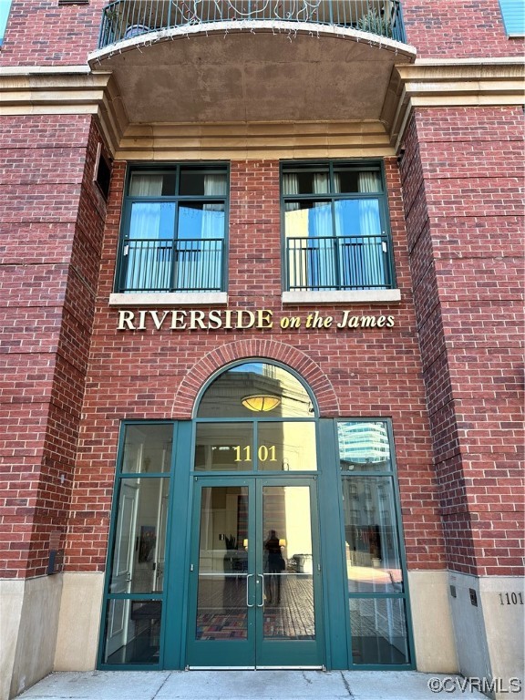 a view of building with front door and outdoor space