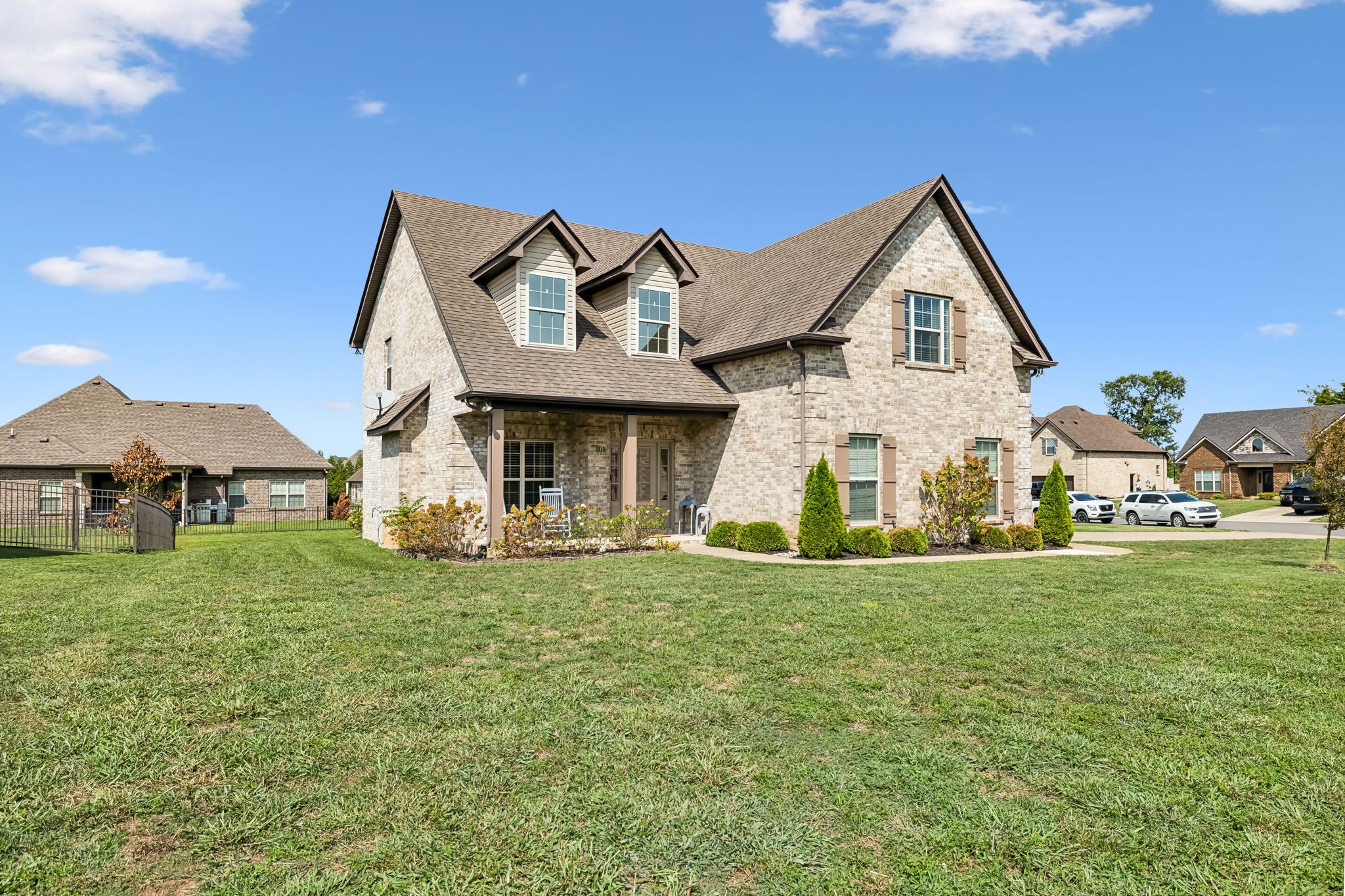 a view of a house with a yard and deck