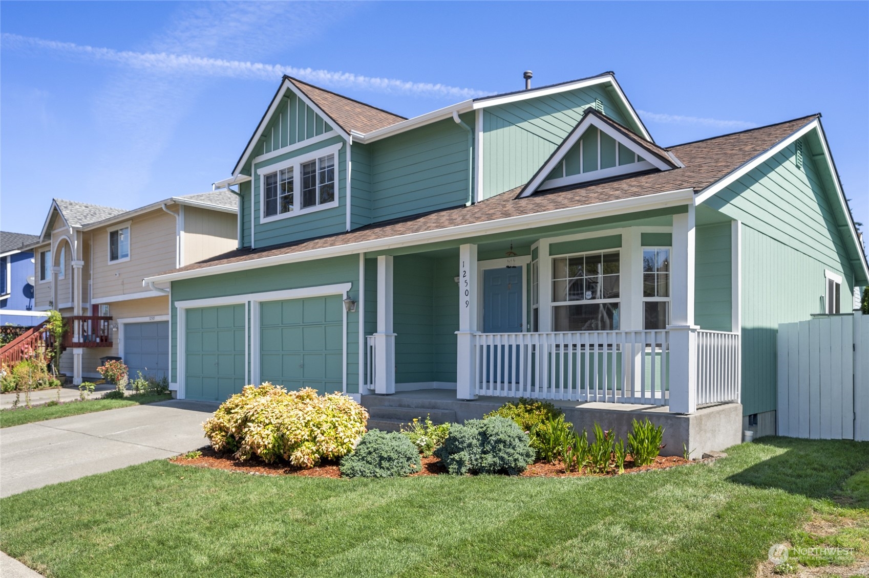 a front view of a house with garden