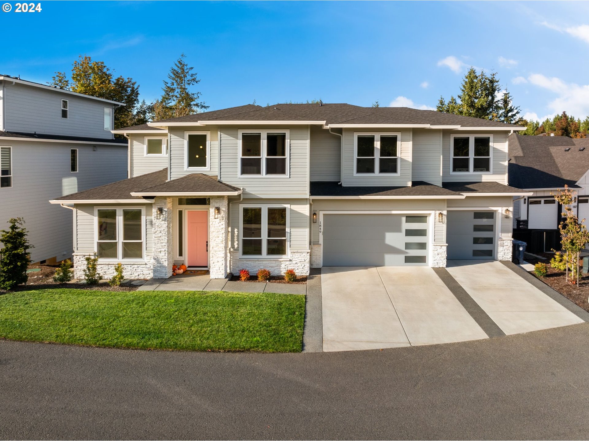 a front view of a house with a yard