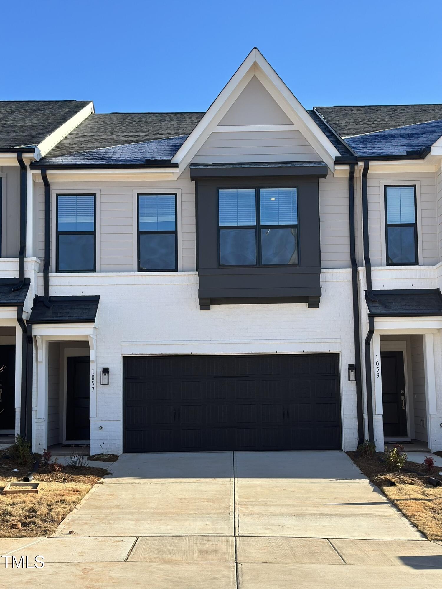 a front view of a house with garage