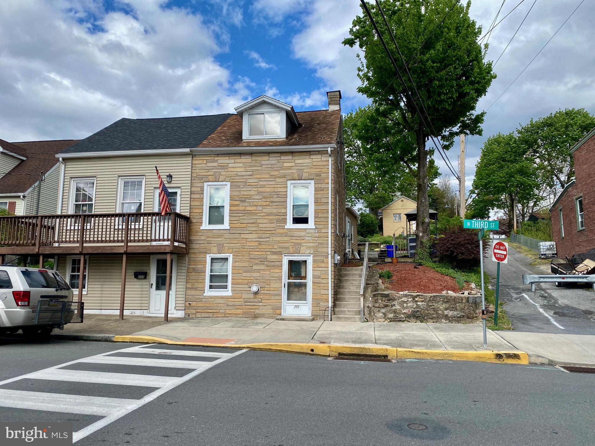 a front view of a building with street view