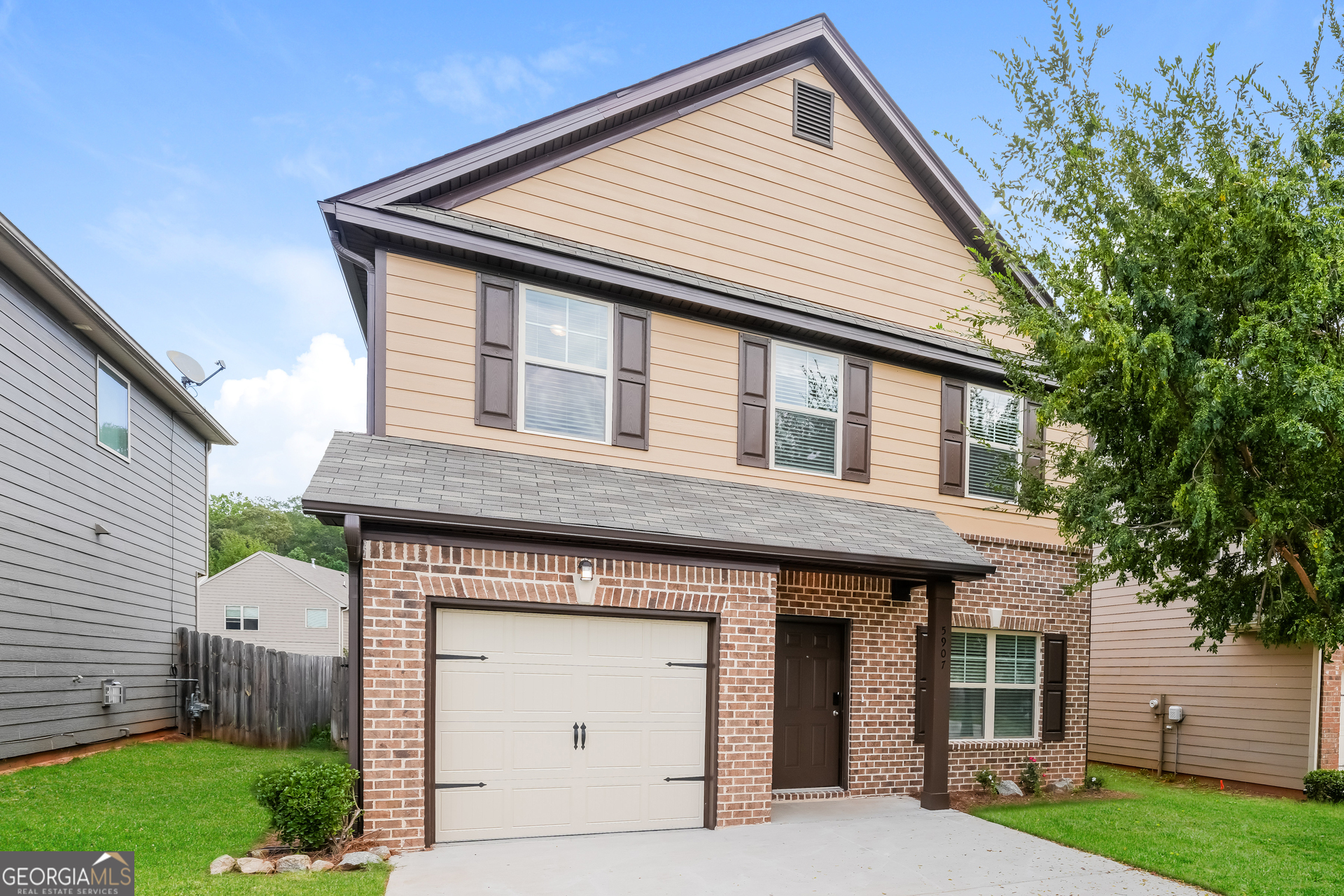 a front view of a house with a yard