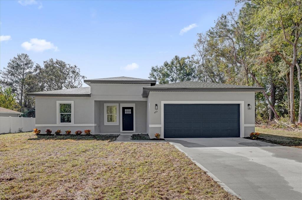 front view of a house with a yard