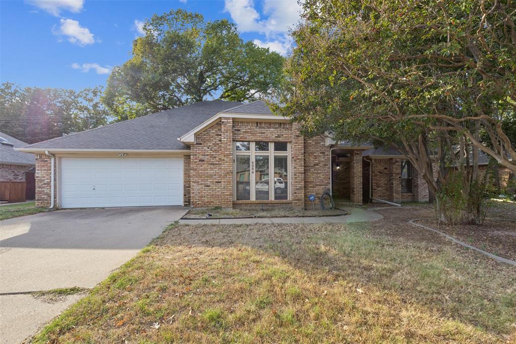 front view of a house with a trees