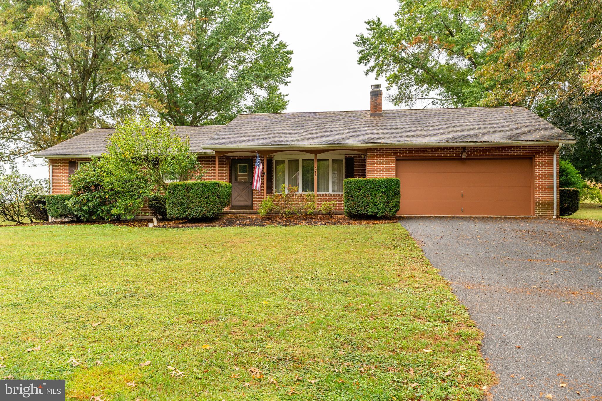 a front view of a house with yard