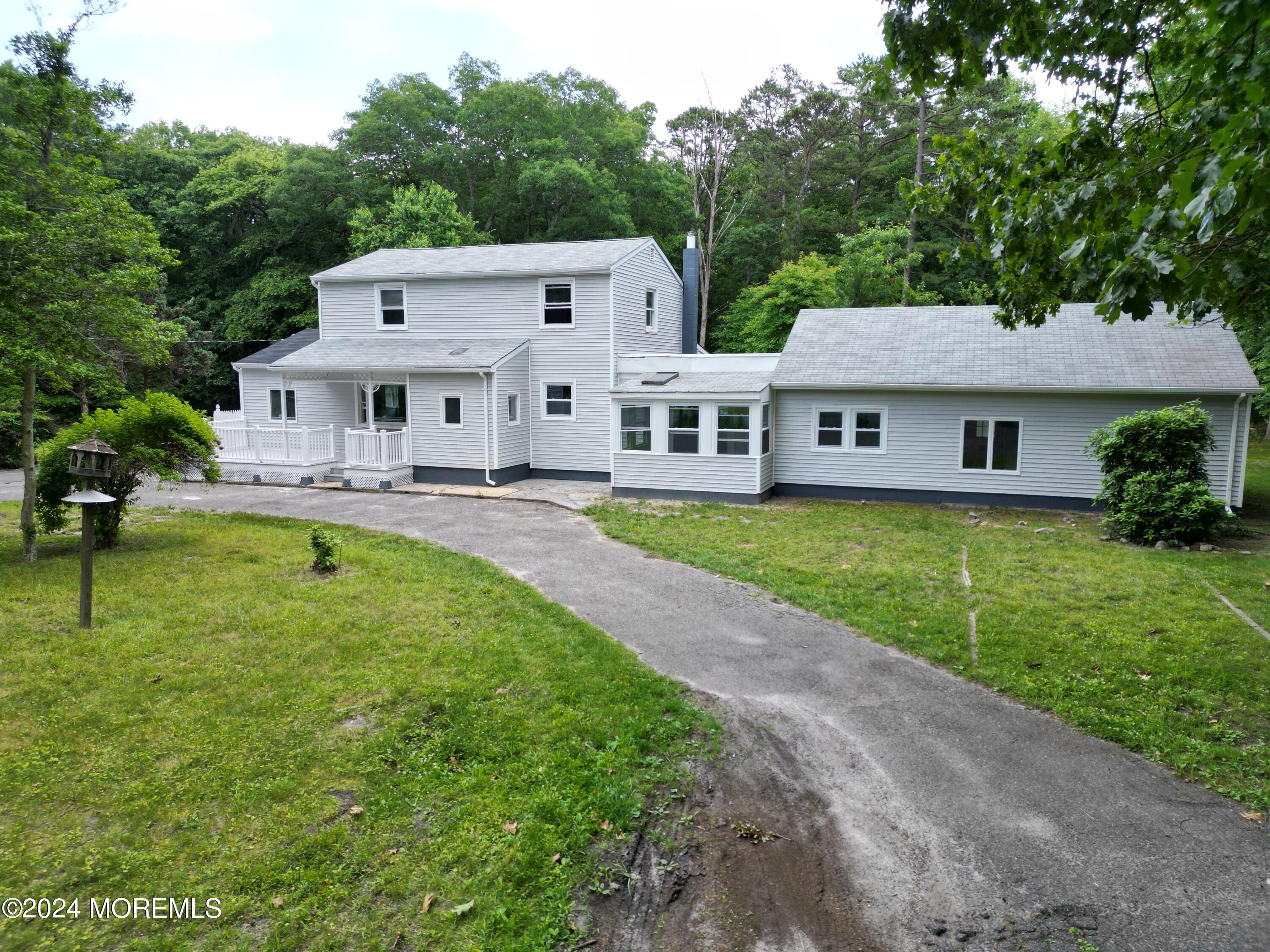 an aerial view of residential house with outdoor space and swimming pool