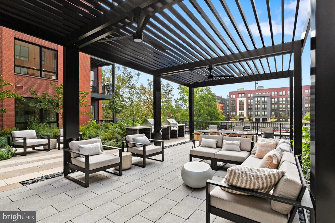 a building outdoor space with patio furniture and a potted plant