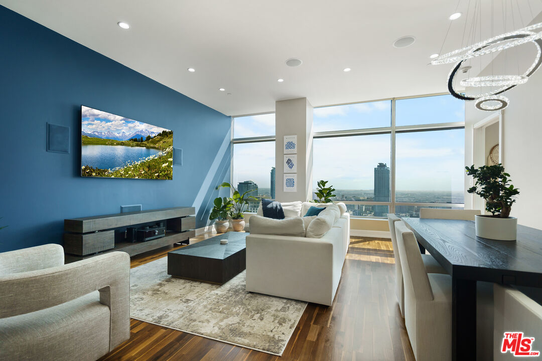 a living room with fireplace furniture and a flat screen tv