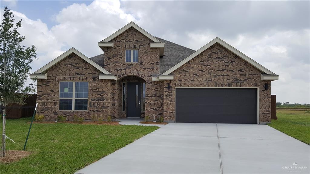 Craftsman-style house with a garage and a front yard