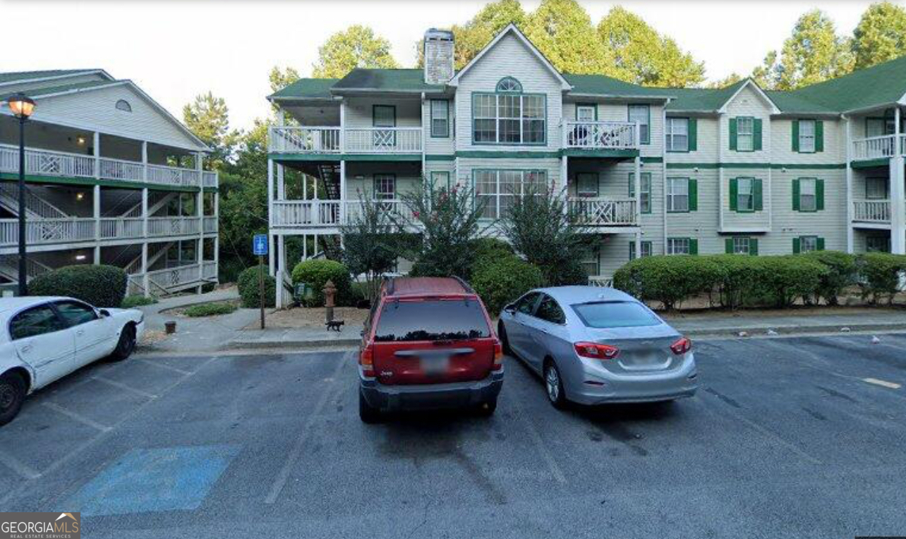 a car parked in front of a brick house