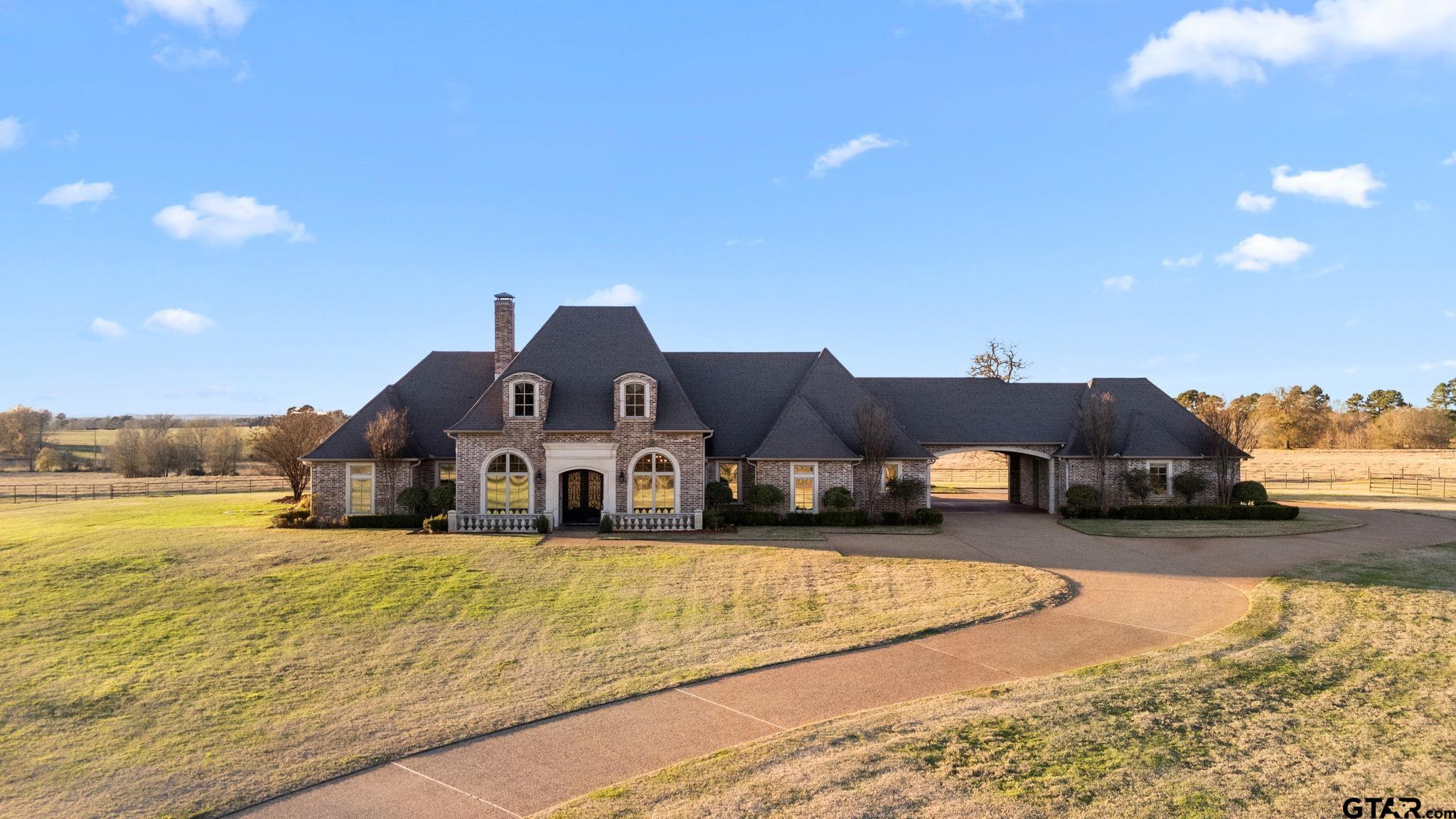 a view of a house with big yard