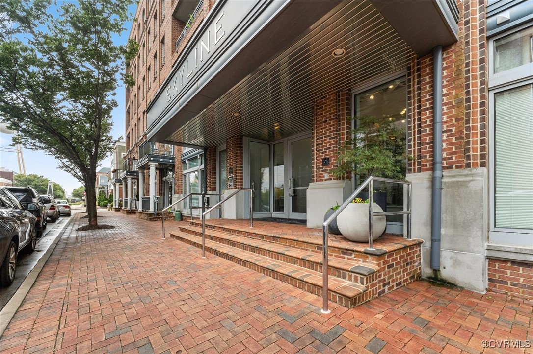 a building outdoor space with patio outdoor seating and covered with trees