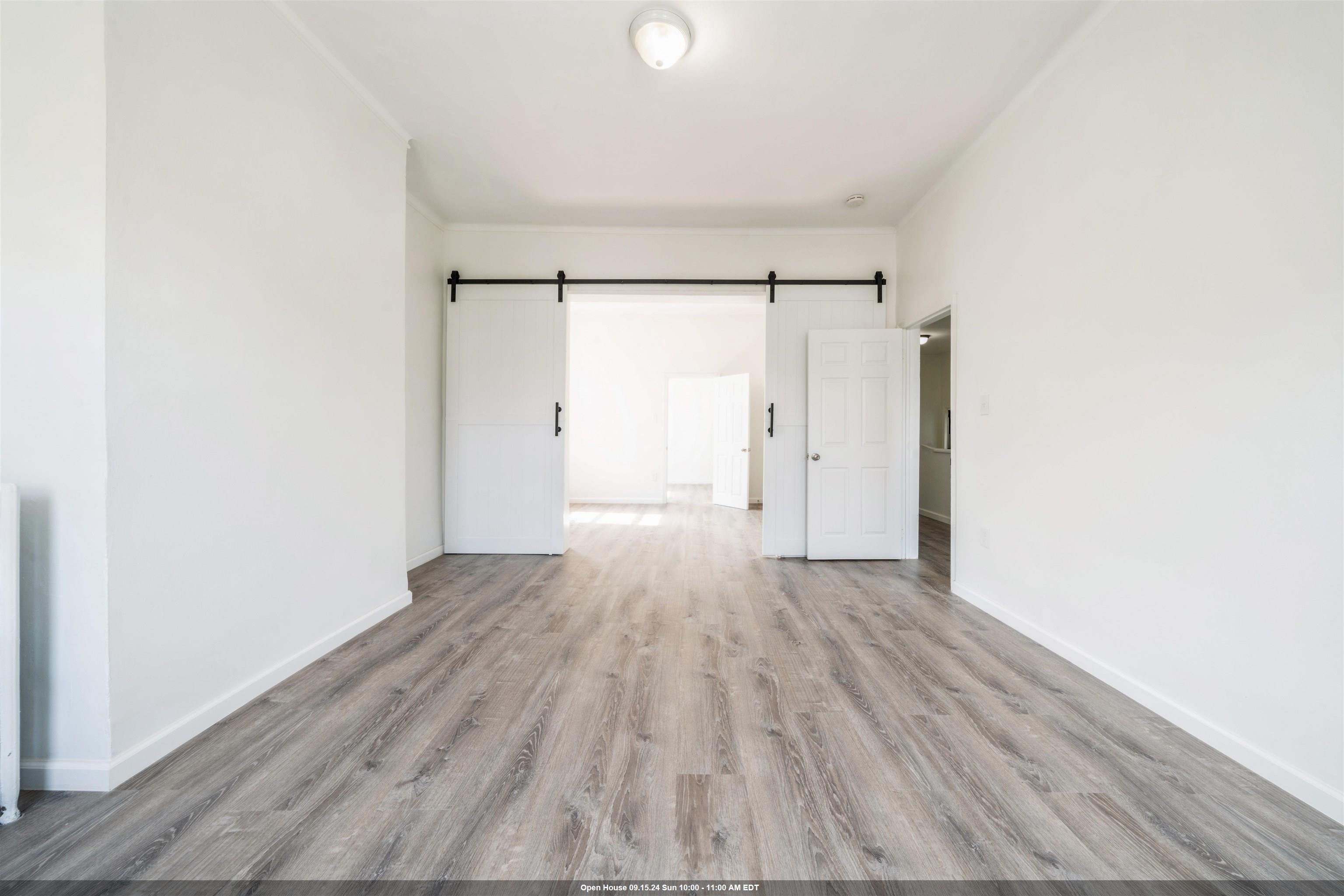 a view of wooden floor in an empty room