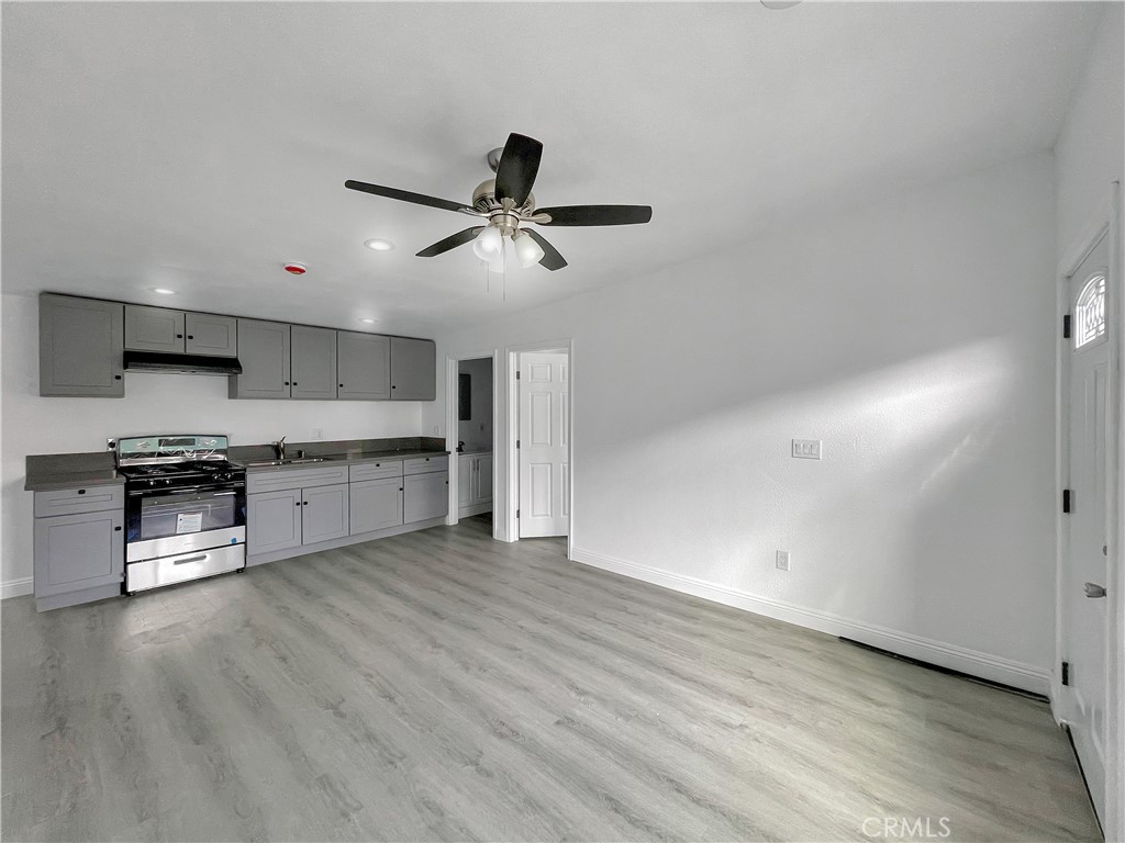 a kitchen with stainless steel appliances a sink and a refrigerator