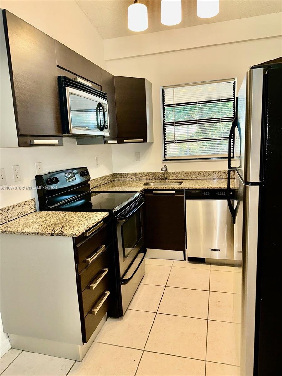 a kitchen with a stove and a microwave