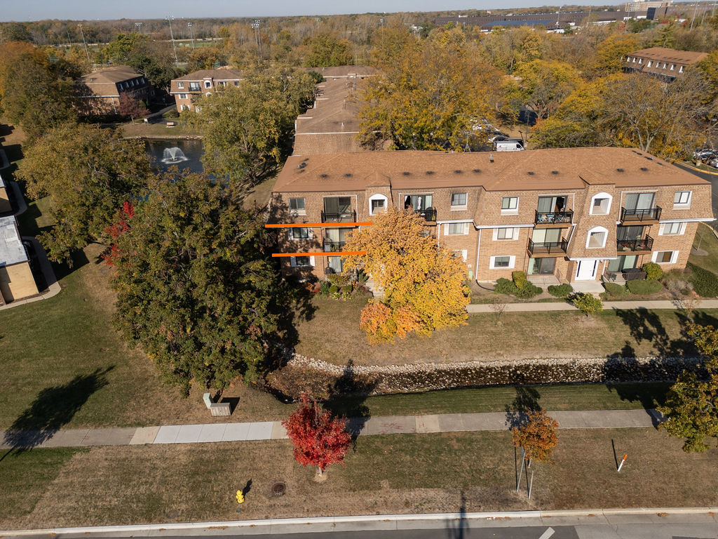 an aerial view of residential houses with outdoor space