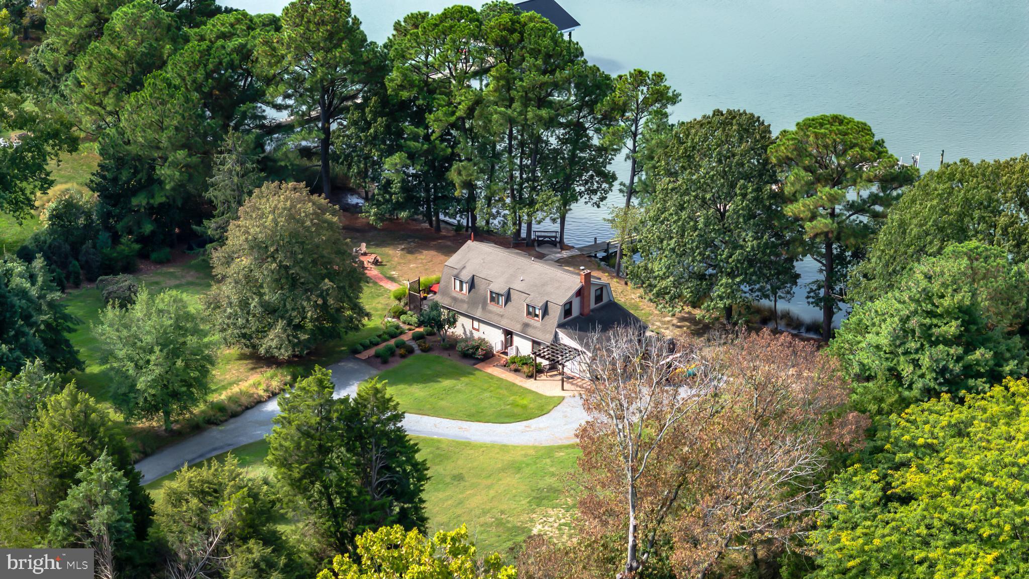 an aerial view of a house with yard swimming pool and outdoor seating