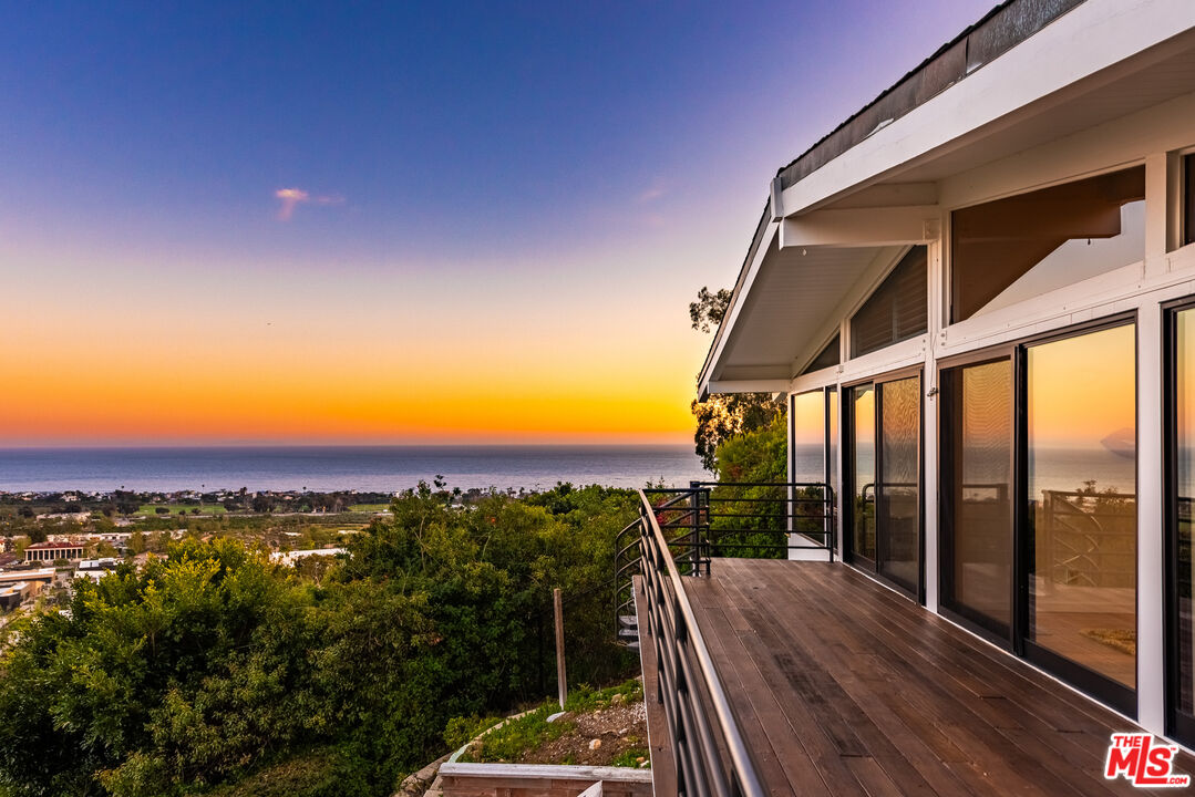 a view of a balcony with mountain view