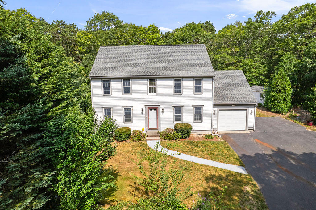 front view of a house with a yard