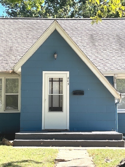 a black and white photo of a house