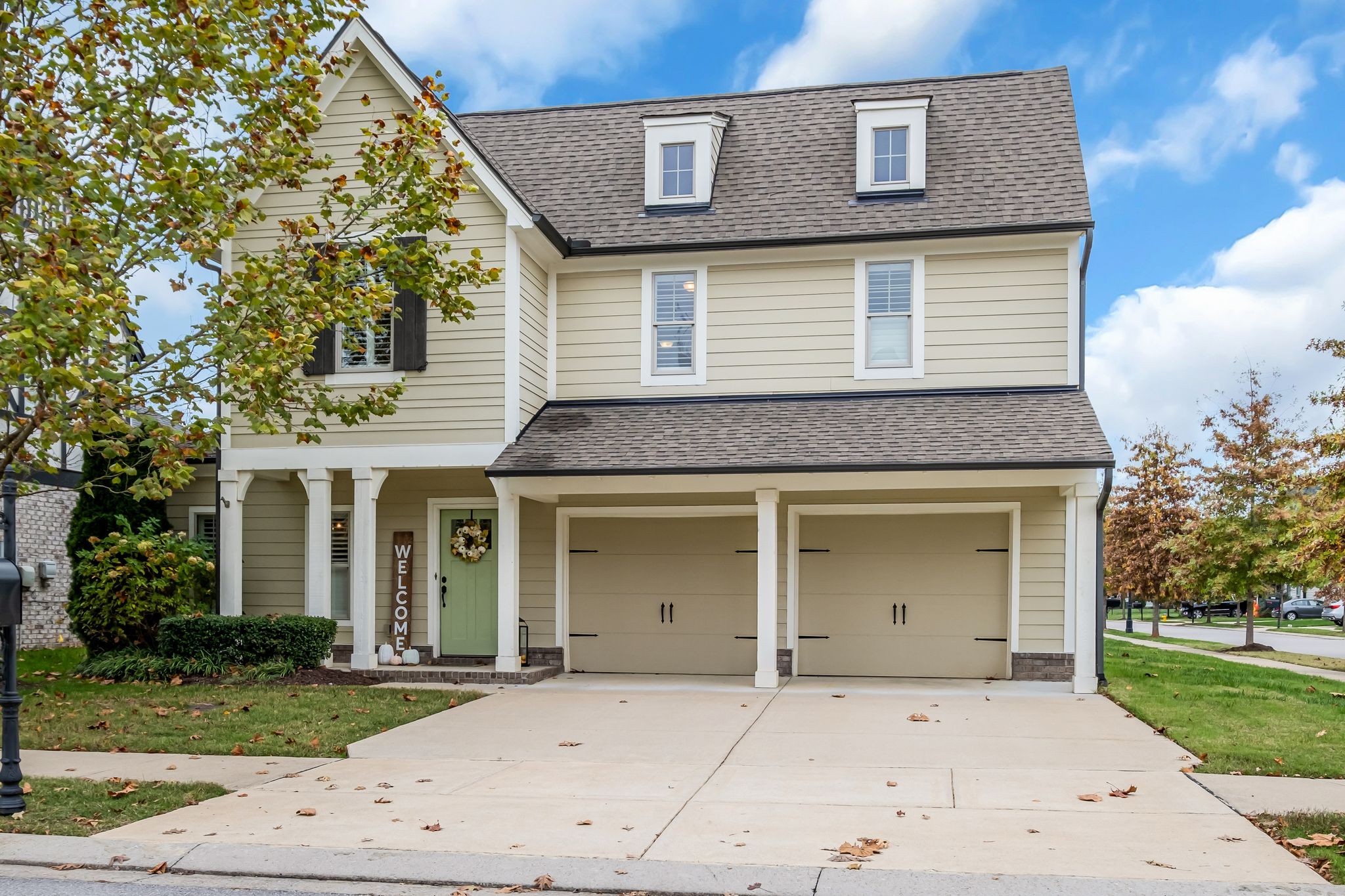 front view of a house with a yard