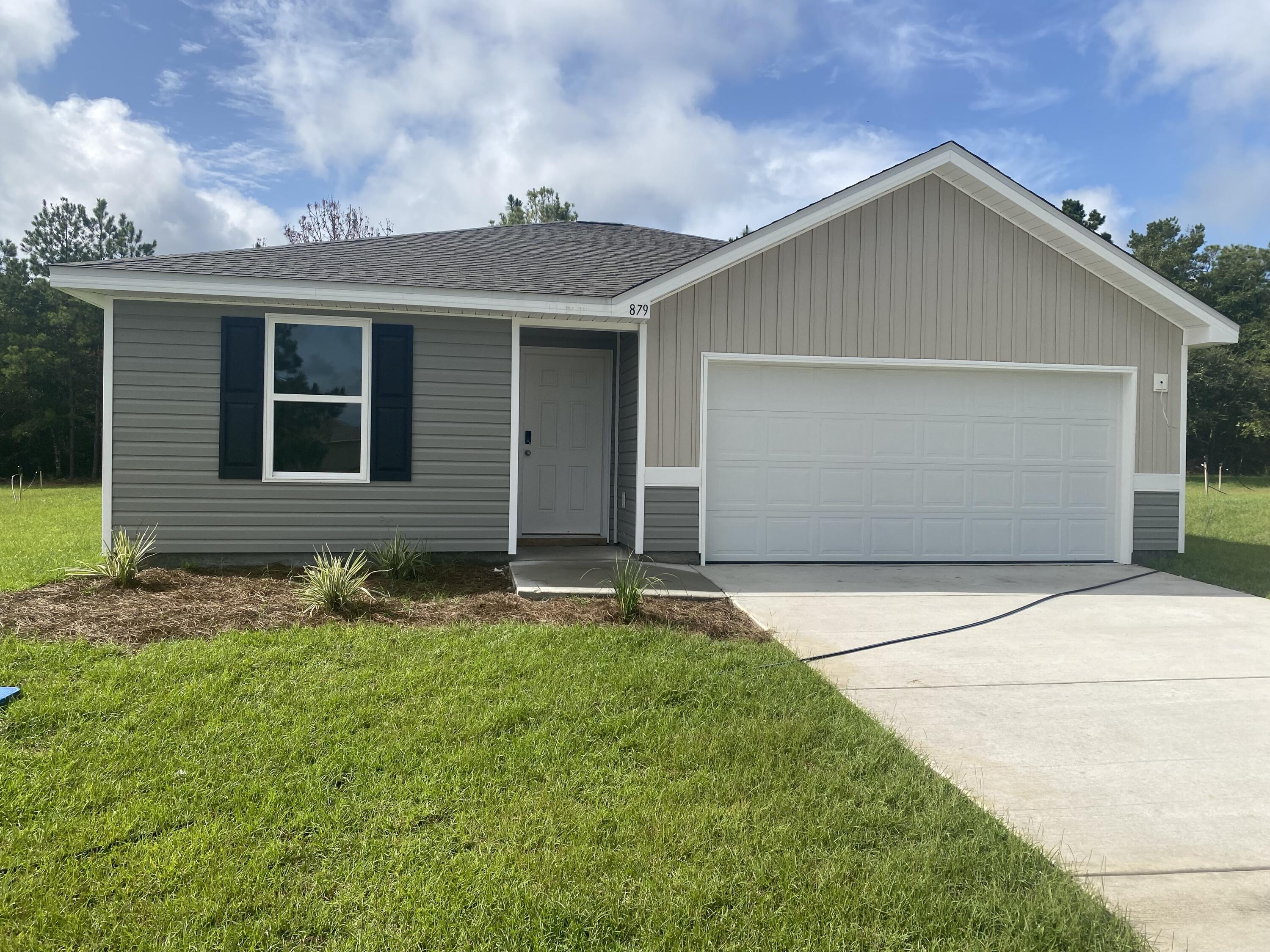 front view of house with a yard