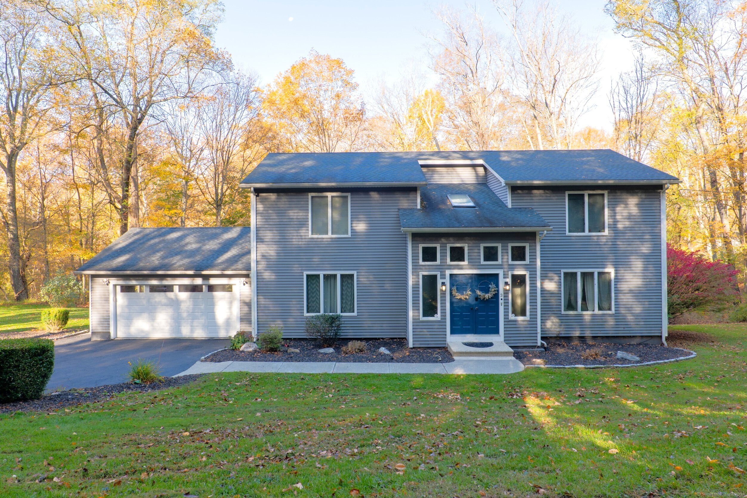 a front view of a house with a yard