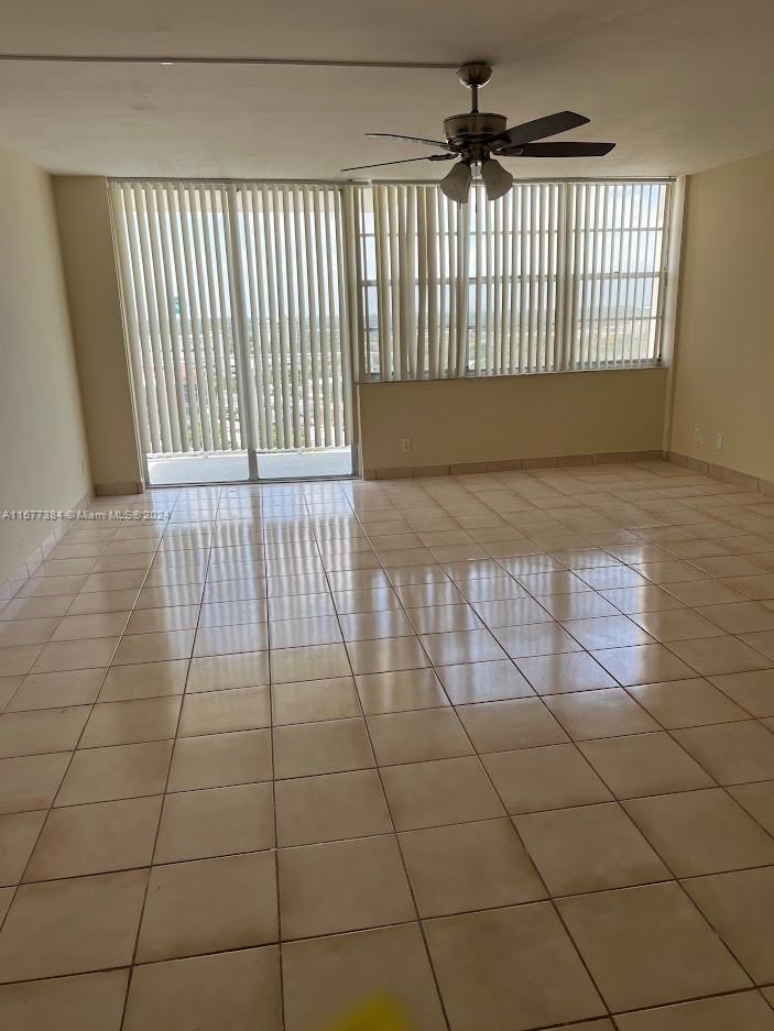 a view of a livingroom with a floor to ceiling window