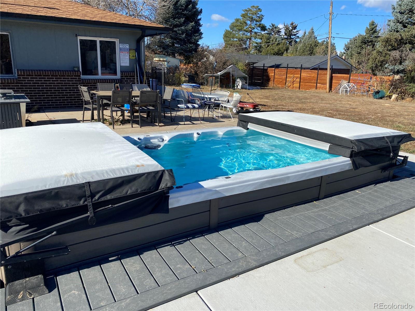 a swimming pool with outdoor seating