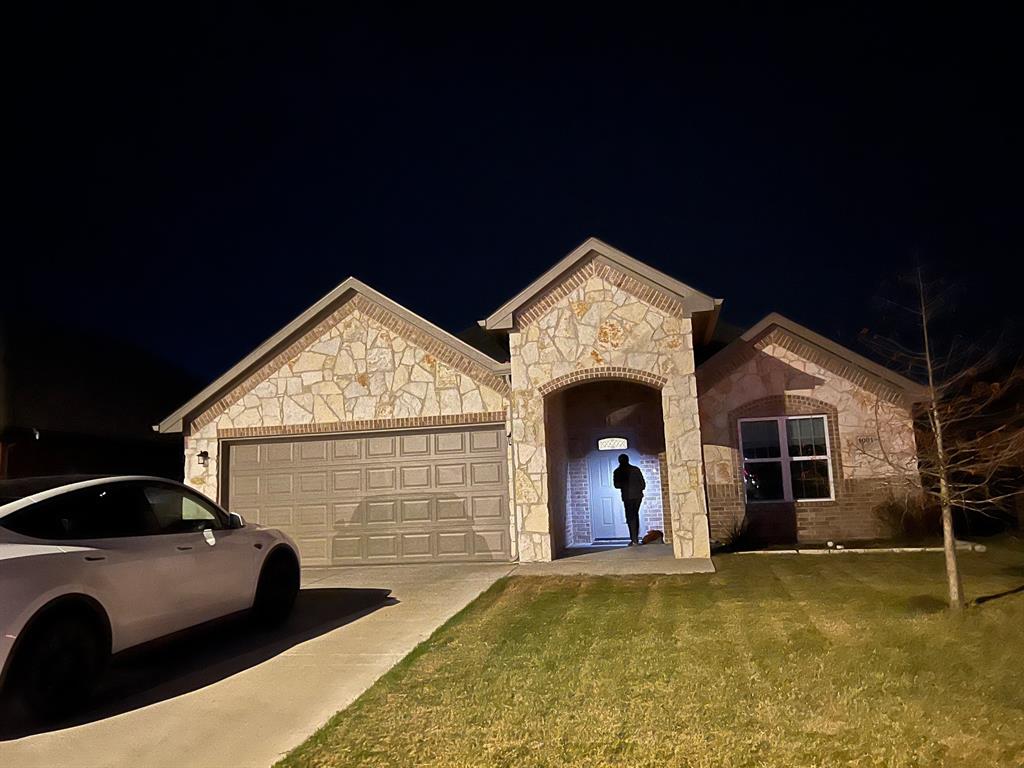 a front view of a house with yard