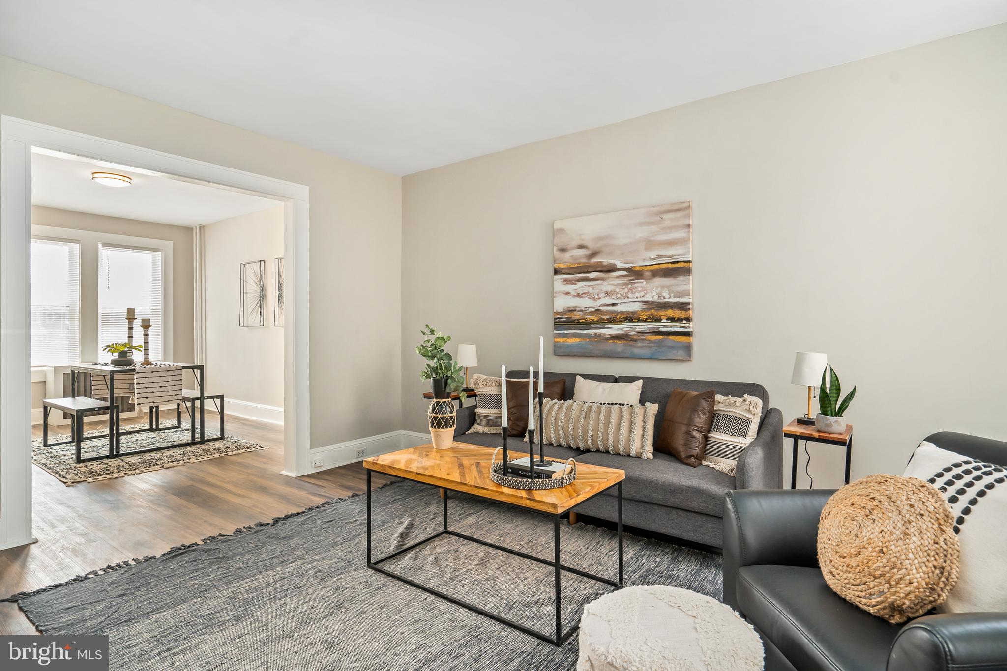 a living room with furniture and a table