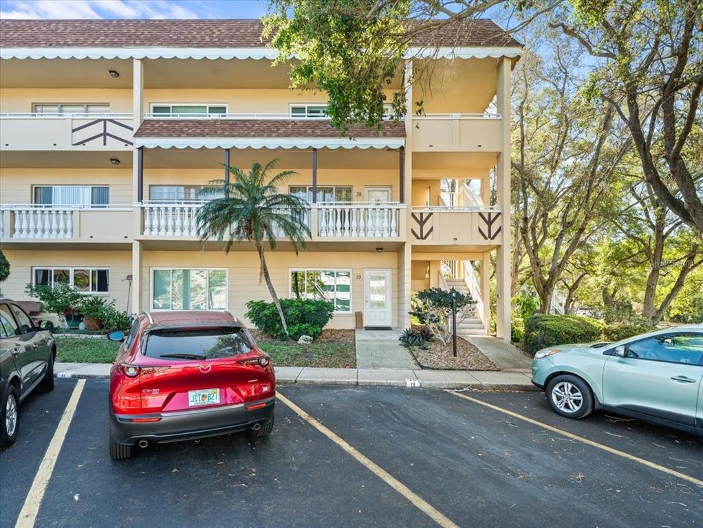 a front view of a house with parking space