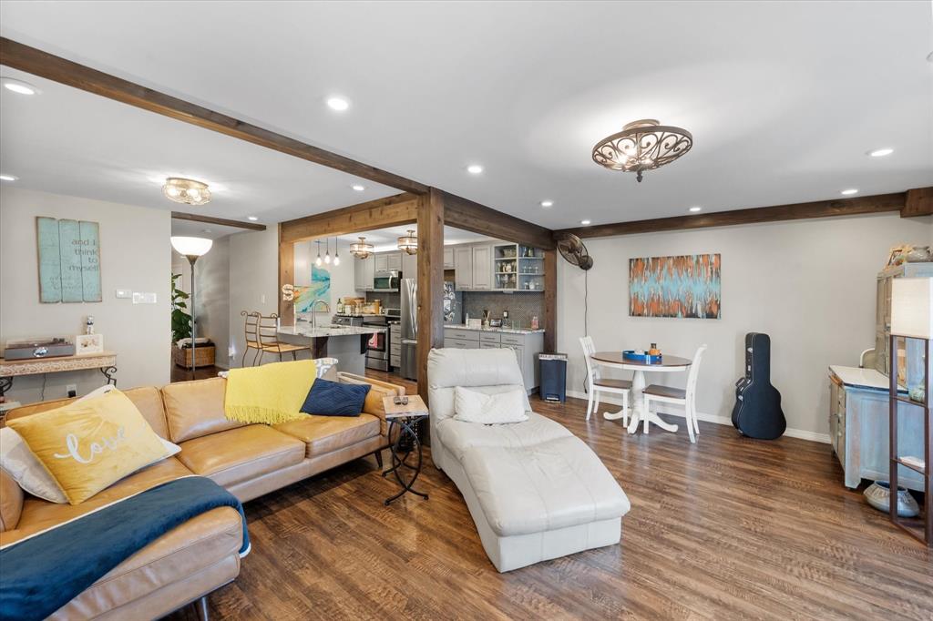 a living room with furniture or couch and a wooden floor