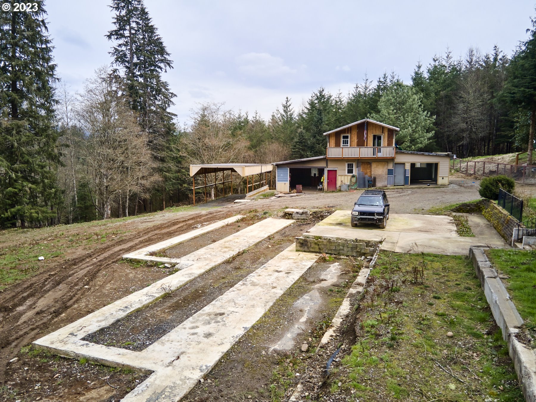 a view of house with outdoor space and sitting area