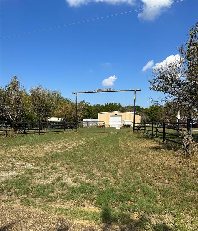 a view of a field with sitting area