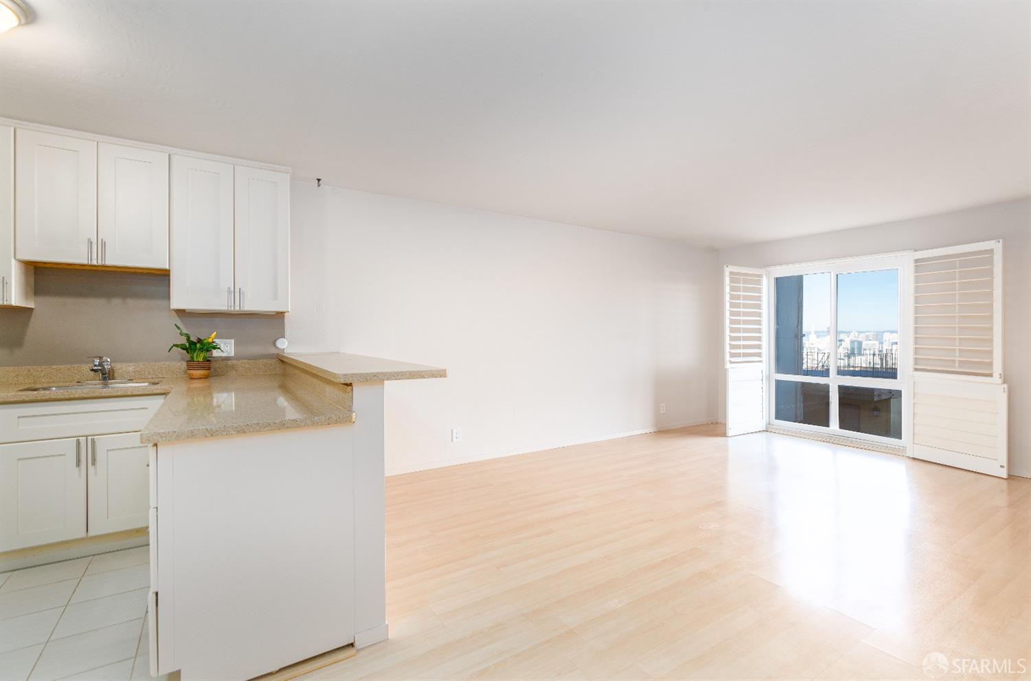 a view of a kitchen with a sink and dishwasher