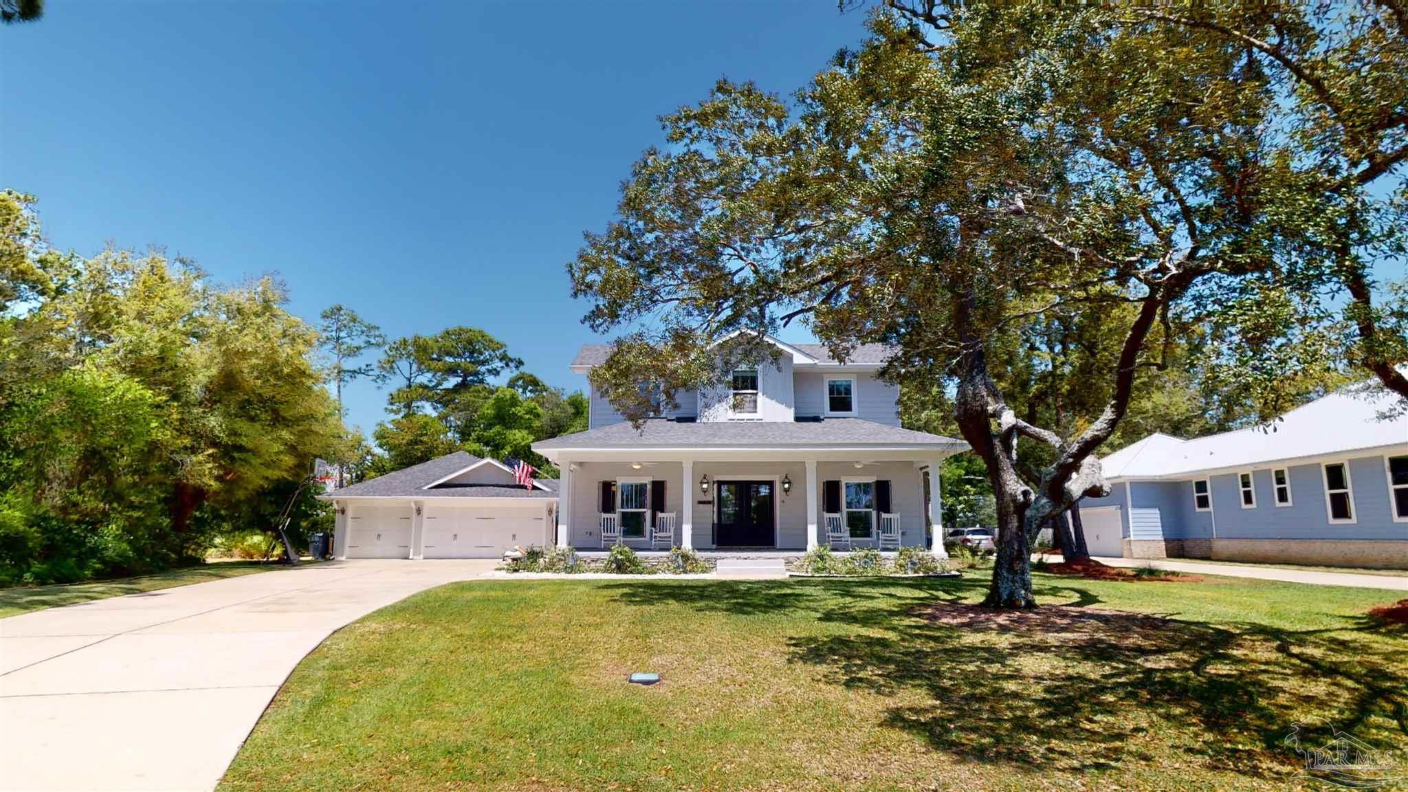 a front view of house with yard space and swimming pool