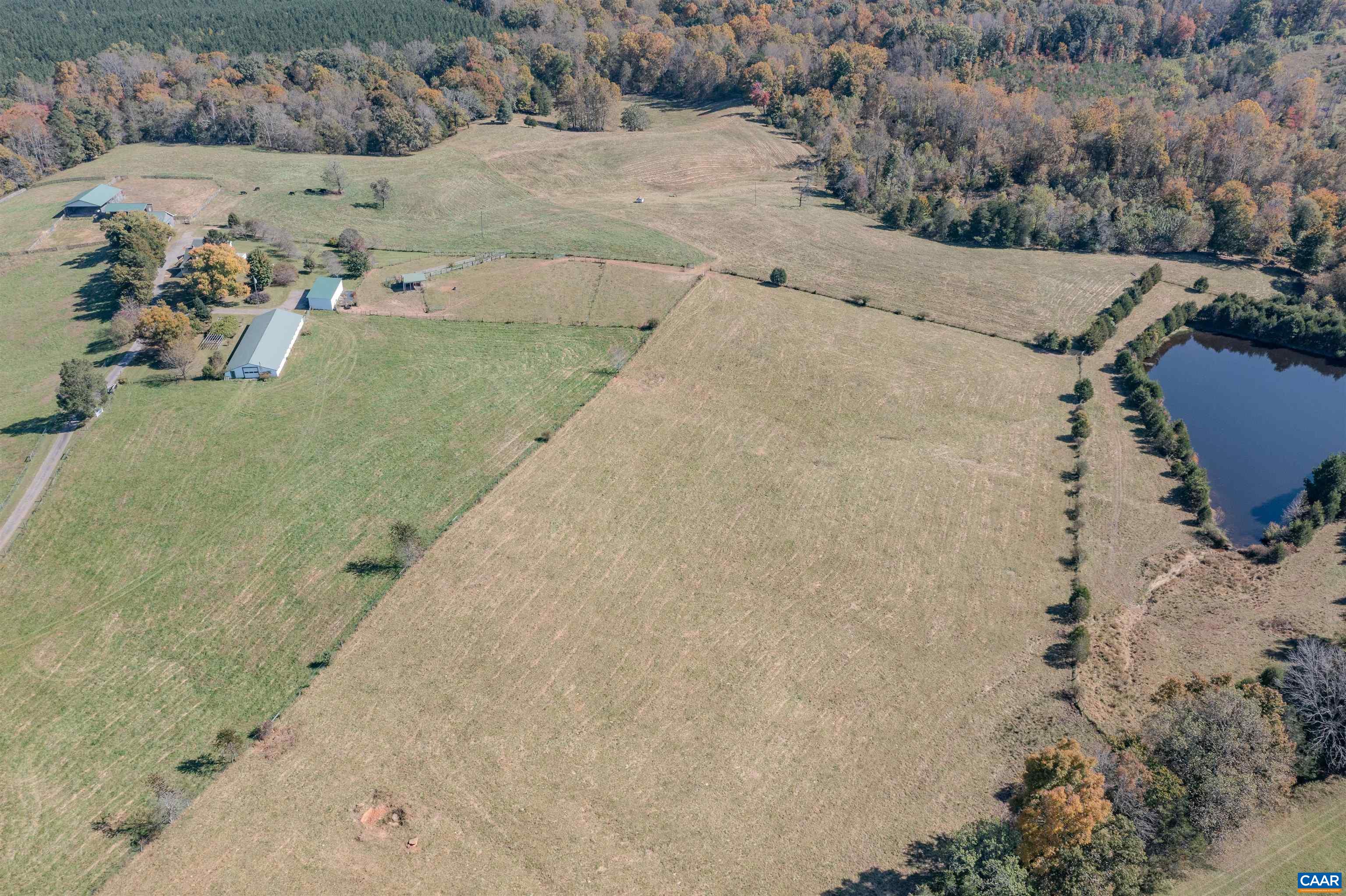 a view of a dry yard with a barn