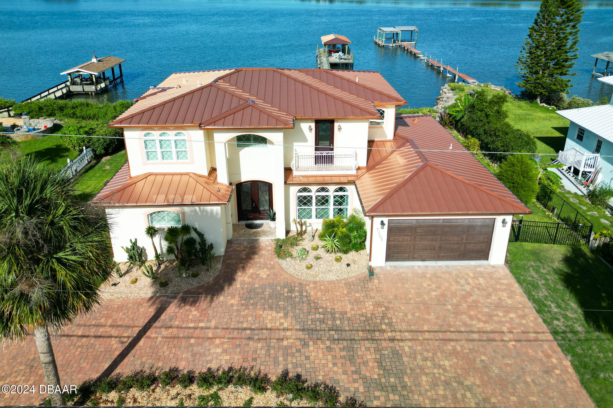 a front view of house with yard and outdoor seating