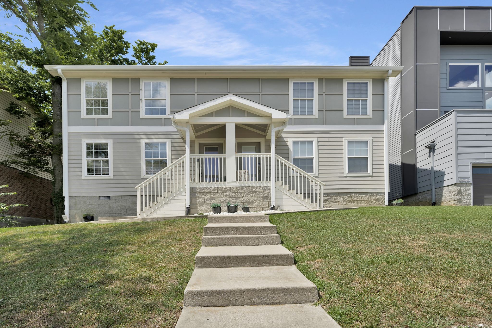 a front view of a house with a yard