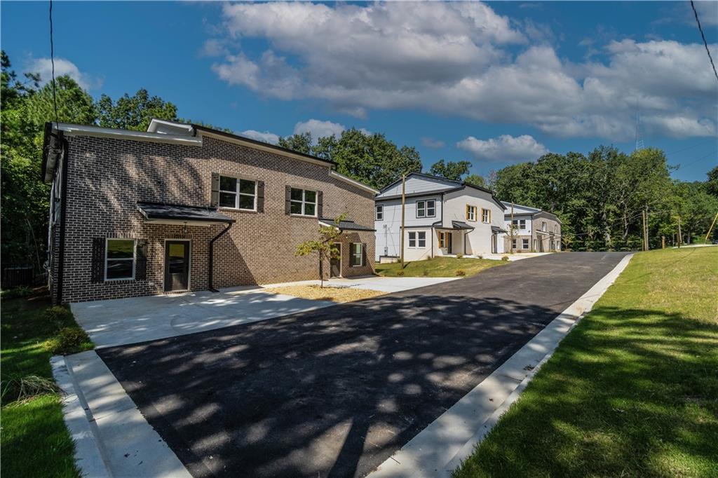 a view of house with yard and entertaining space